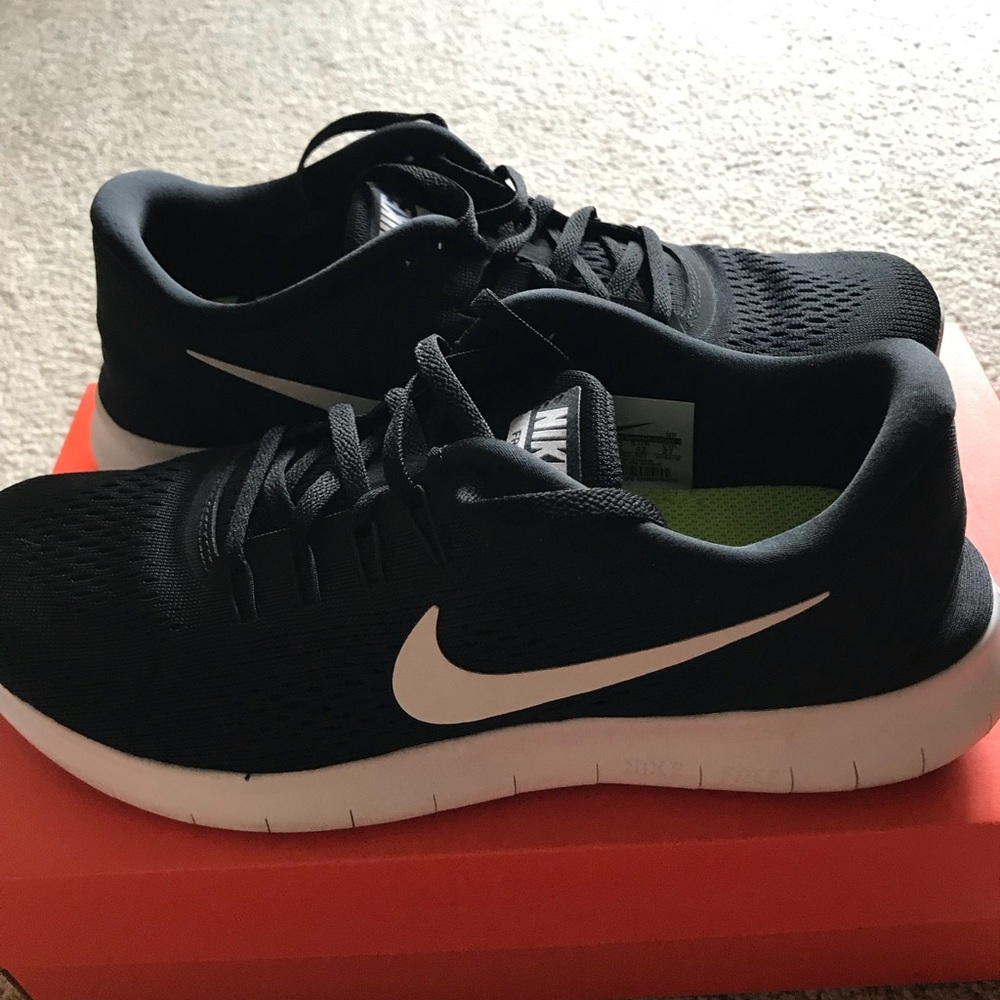 Women’s black Nike running shoes.
